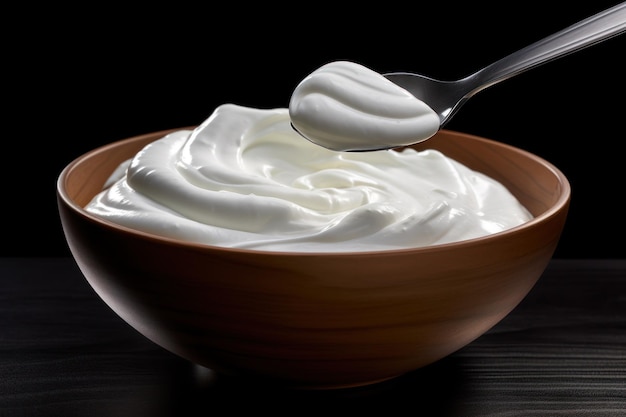 Whipped Cream in Wooden Bowl with Spoon