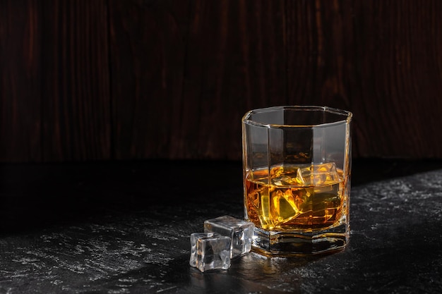 Whiskey with Ice on a Wooden Table