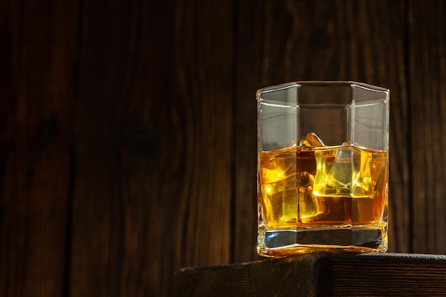 Whiskey with Ice on a Wooden Table