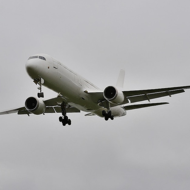 a white airplane with the number 8 on the tail is flying in the sky