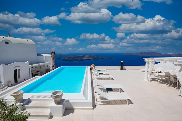 White architecture on Santorini island Greece Luxury swimming pool with sea view Famous travel