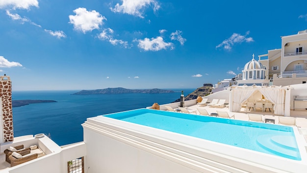 White architecture on Santorini island Greece Swimming pool in luxury hotel Beautiful view sky