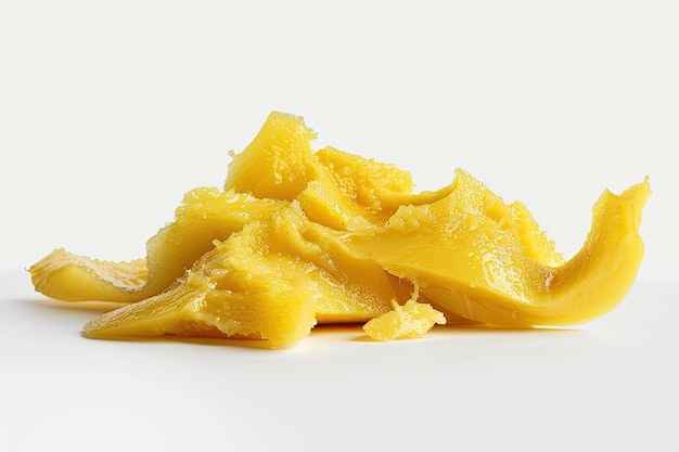 On a white background yellow mango pulp is isolated