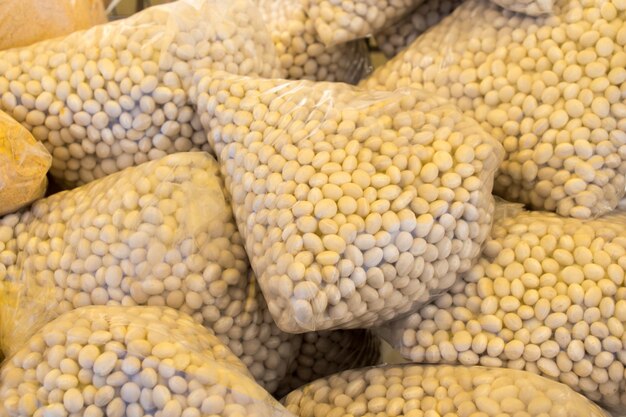 White beans in plastic packaging on display