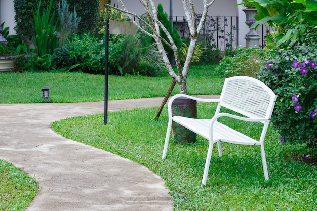 White bench in summer park