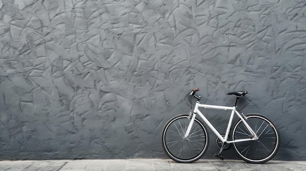 White Bicycle Against a Gray Wall