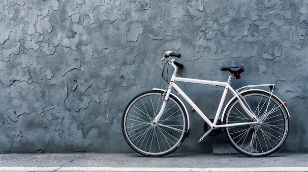 White Bicycle Leaned Against a Grey Wall