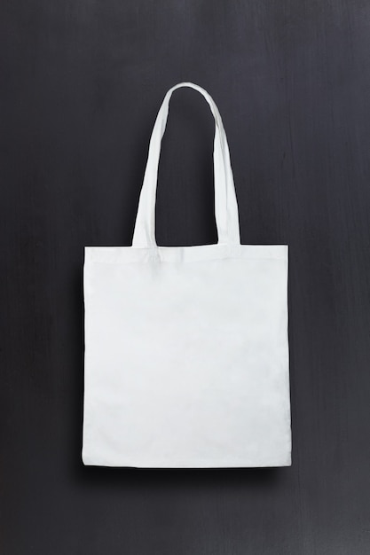 White black fabric bag against chalkboard background