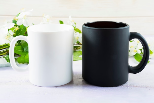 White and black mug mockup with spring apple blossom