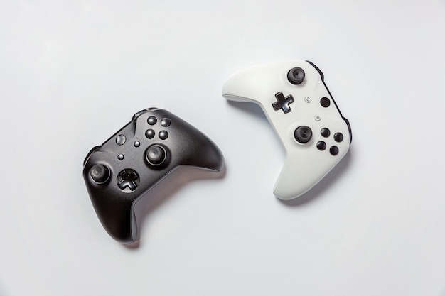 White and black two joystick gamepad, game console isolated on white