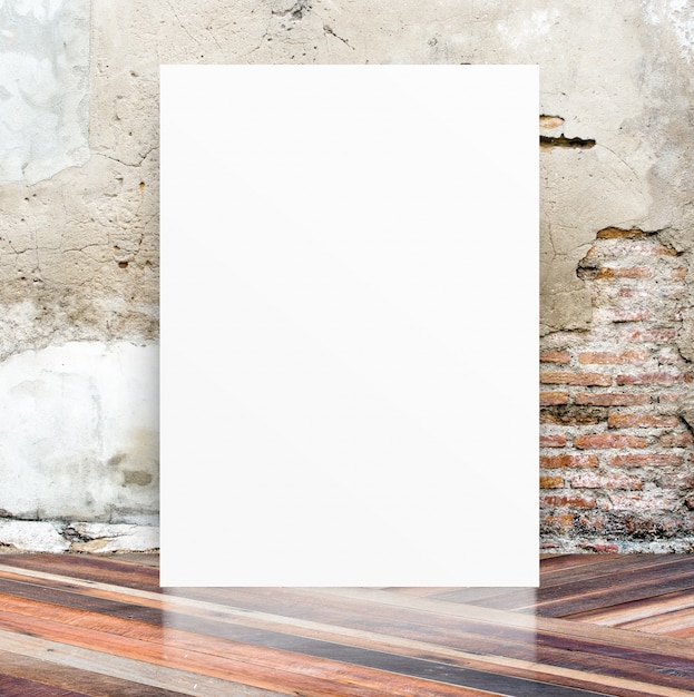 White Blank Poster in crack cement wall and diagonal wooden floor room,Template Mock up for your content,Business presentation