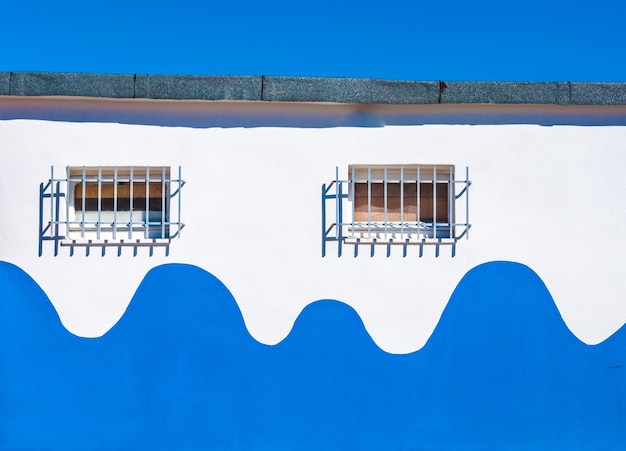 White and blue building on the beach