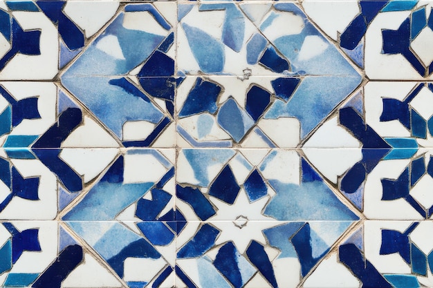 white and blue tile with an intricate geometric pattern