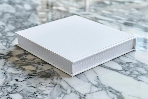 a white book on a marble table with a white cover