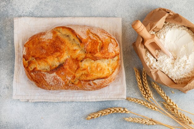 white bread , flour and wheat spikelets