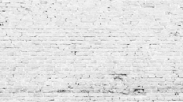 White brick wall texture grunge background may use to interior designxA