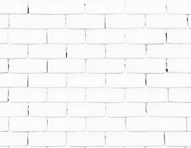 Photo a white brick wall with a black mark on it