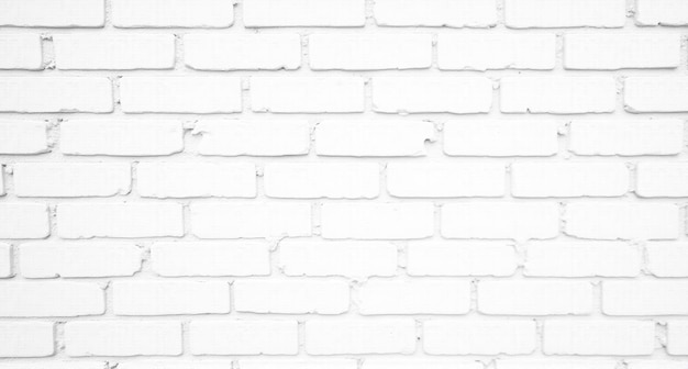 Photo a white brick wall with a crack in the middle