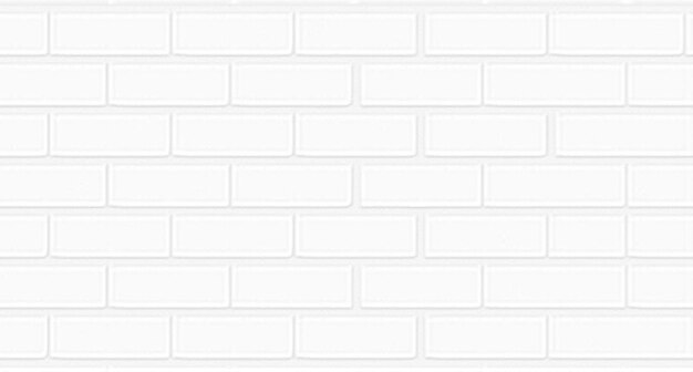 Photo a white brick wall with a white brick background