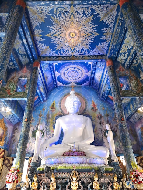 White Buddha at Blue temple Wat Rong Seur Ten Temple in Chiang Rai, Thailand.