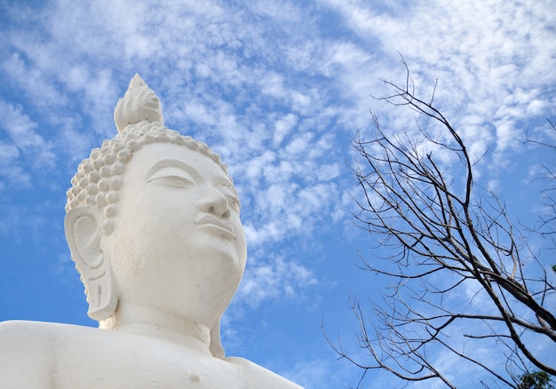 White Buddha statue and blue sky