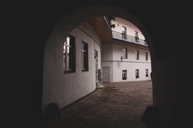 A white building with a balcony and a balcony with a sign that says'the word'on it '