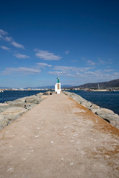 White butka lighthouse on the pier