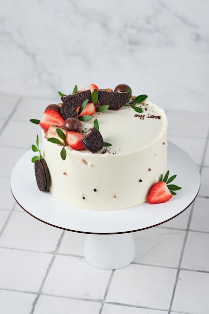 White cake with fresh berries for a loved one Holiday confectionery