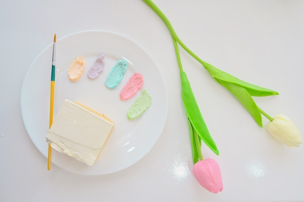 White cake with painted on white background,DIY cake,
dessert