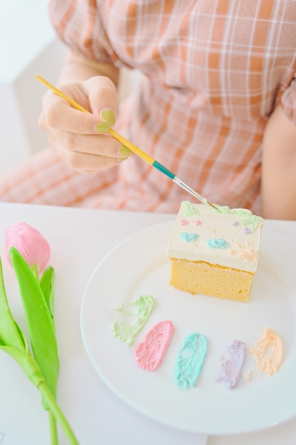 White cake with painted on white background,DIY cake,
dessert