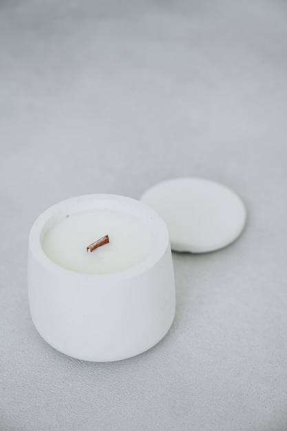 White Candle in Plaster Pot with Lid Diagonally Closeup Top View Candle Handmade