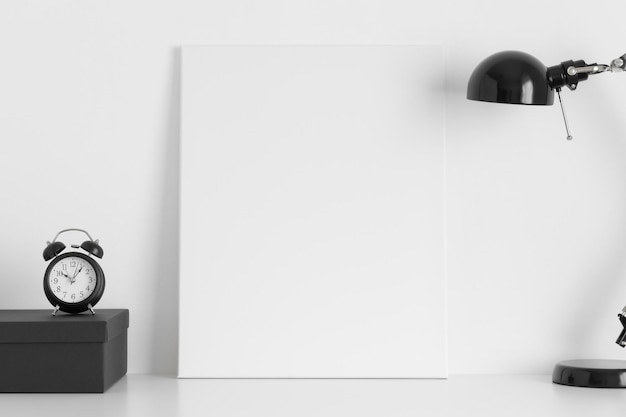 White canvas mockup with workspace accessories on the desk