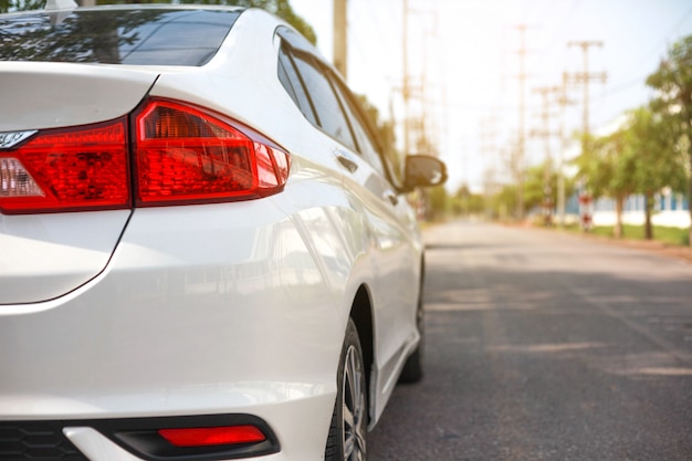 White car parked on the roadside