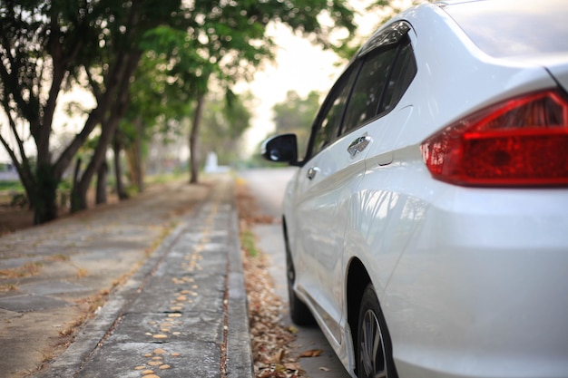 White car on parking,Close up side of white car on the road