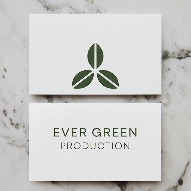 Photo a white card with a green leaf on it that says quot ever green production quot