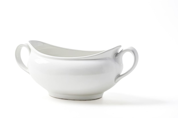 White ceramic gravy boat isolated on white background