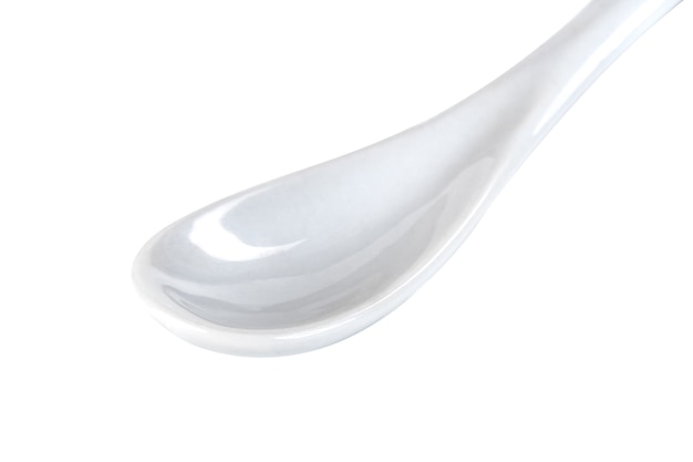 White ceramic spoon isolated on a white, tableware