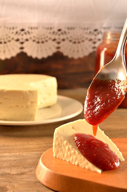 white cheese with guava on a wooden board