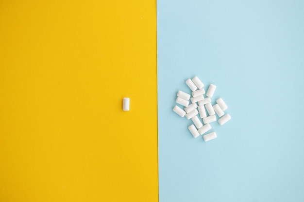 White chewing gum on color background