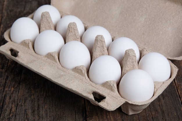 White chicken eggs in a cardboard box