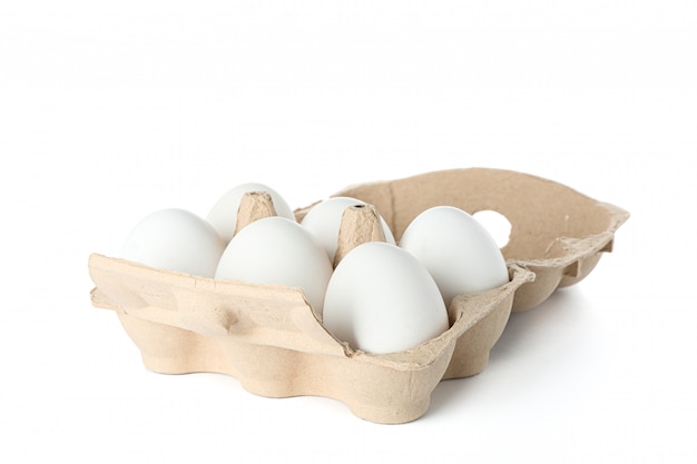 White chicken eggs in carton box isolated on white