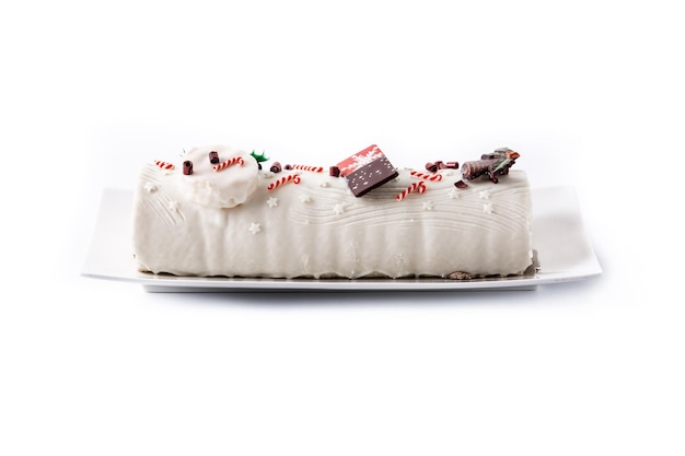 White chocolate yule log cake with ornament