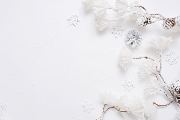 White Christmas border with cones, snowflakes and snown flowers