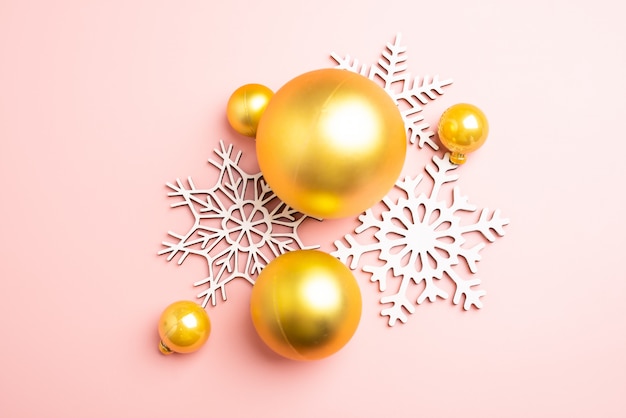 White christmas snowflakes decoration on pink background. christmas wallpaper.