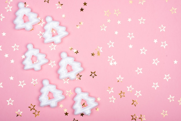 White christmas snowflakes decoration on pink background. christmas wallpaper