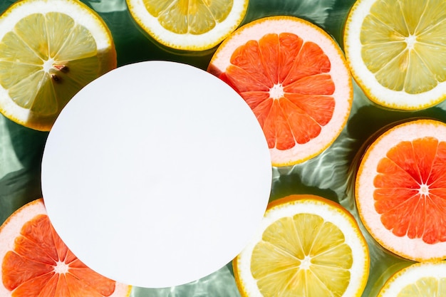 White circle copy space in transparent fresh exhilarant wave water with fleck background lemon grapefruit citrus slice