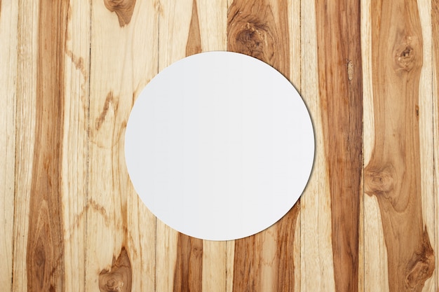 White circle paper and space for text on wooden background