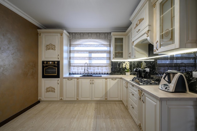 White classic cozy kitchen and dining room in city house