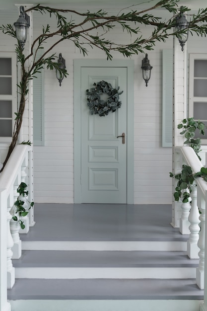 White Classic wooden house entrance and stairs