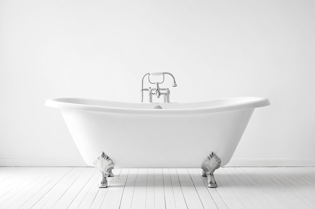 White clawfoot bathtub in a white bathroom